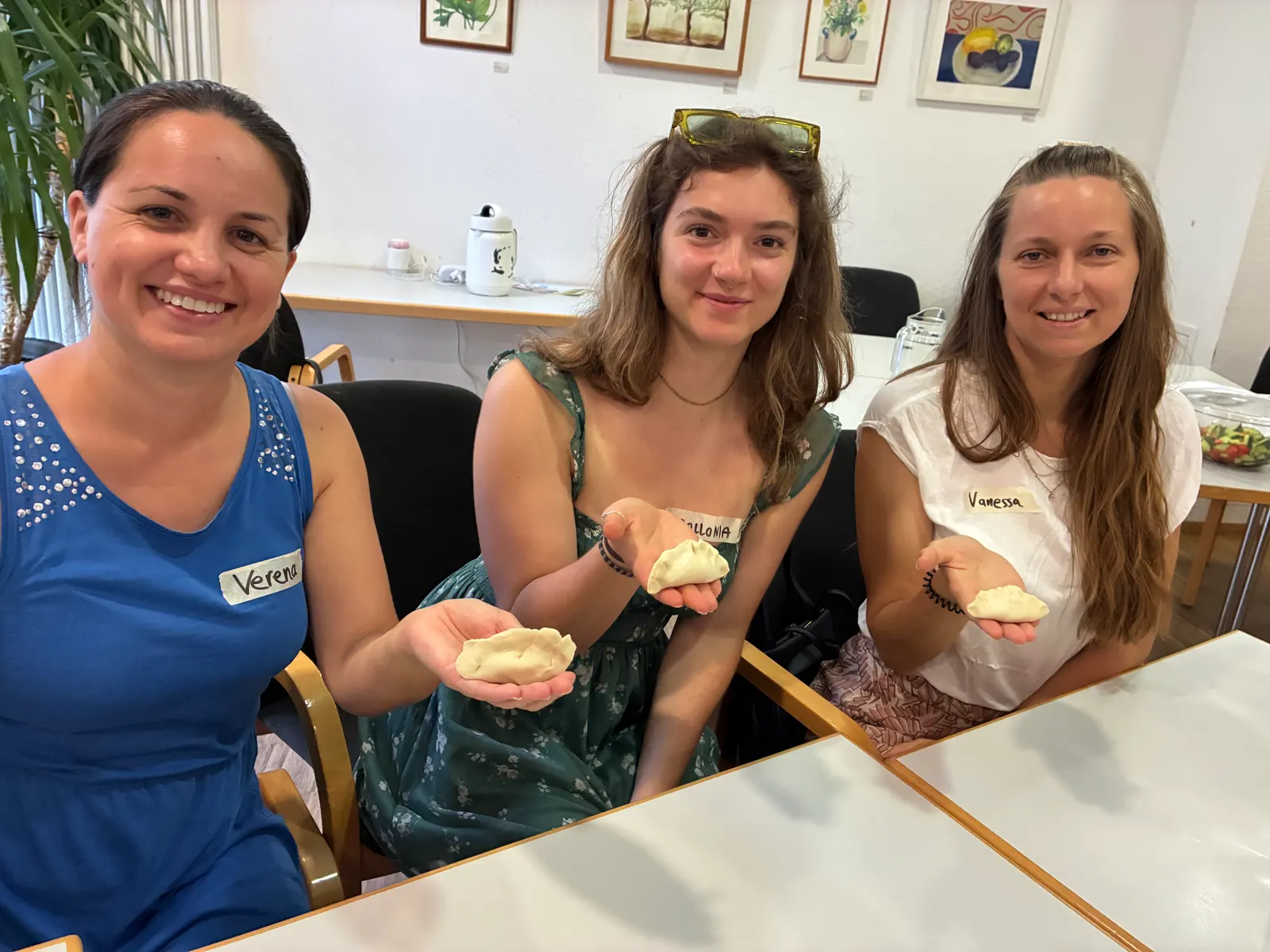 A group making dumplings together at an Über den Tellerrand cooking event